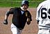 Hilker rounds Third to score
